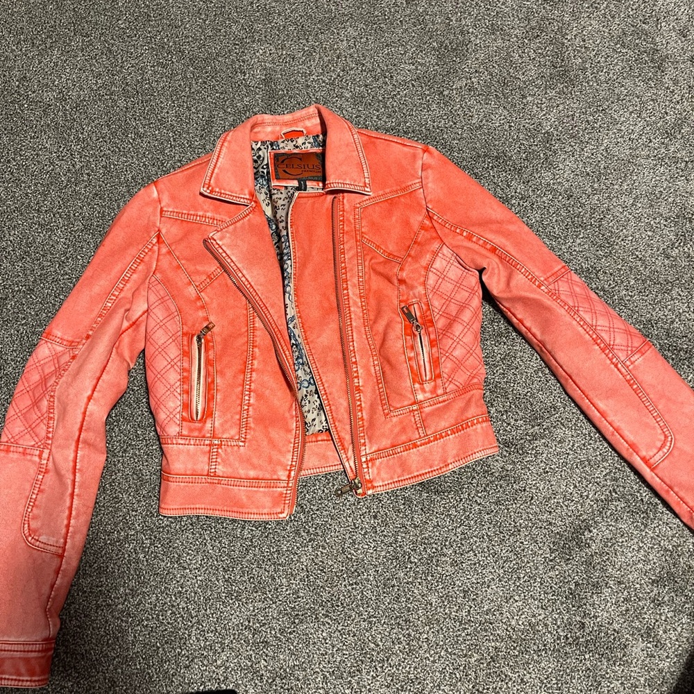 Salmon colored leather moto jacket.